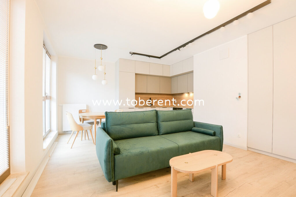 For long-term rent: A luxurious 2-room apartment in a prestigious location with a parking space and a spacious terrace!